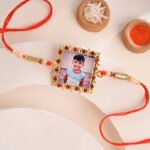 personalised-red-stone-studded-golden-rakhi-ven-48-rk1095-B_0