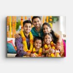 Happy Indian family portrait on a vibrant landscape canvas photo print